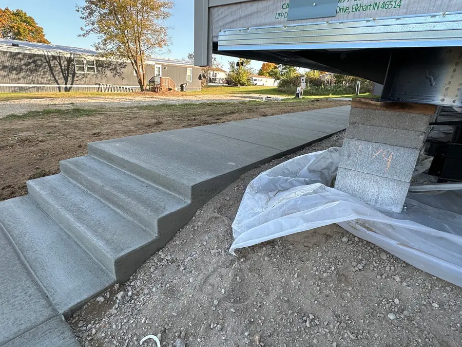 New concrete steps and landing at a residential entrance