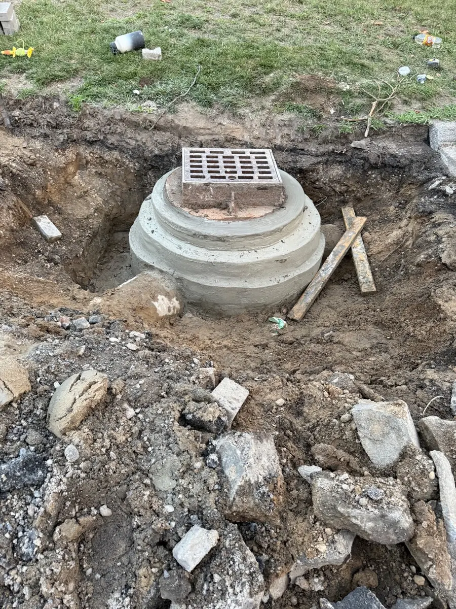 Catch basin and drainage connection exposed during site work
