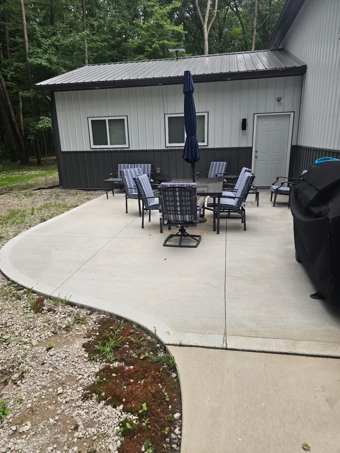Residential concrete patio with a rounded outer edge